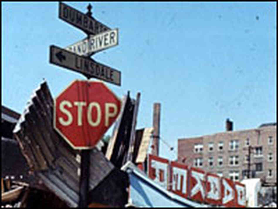 Stop sign amid wreckage