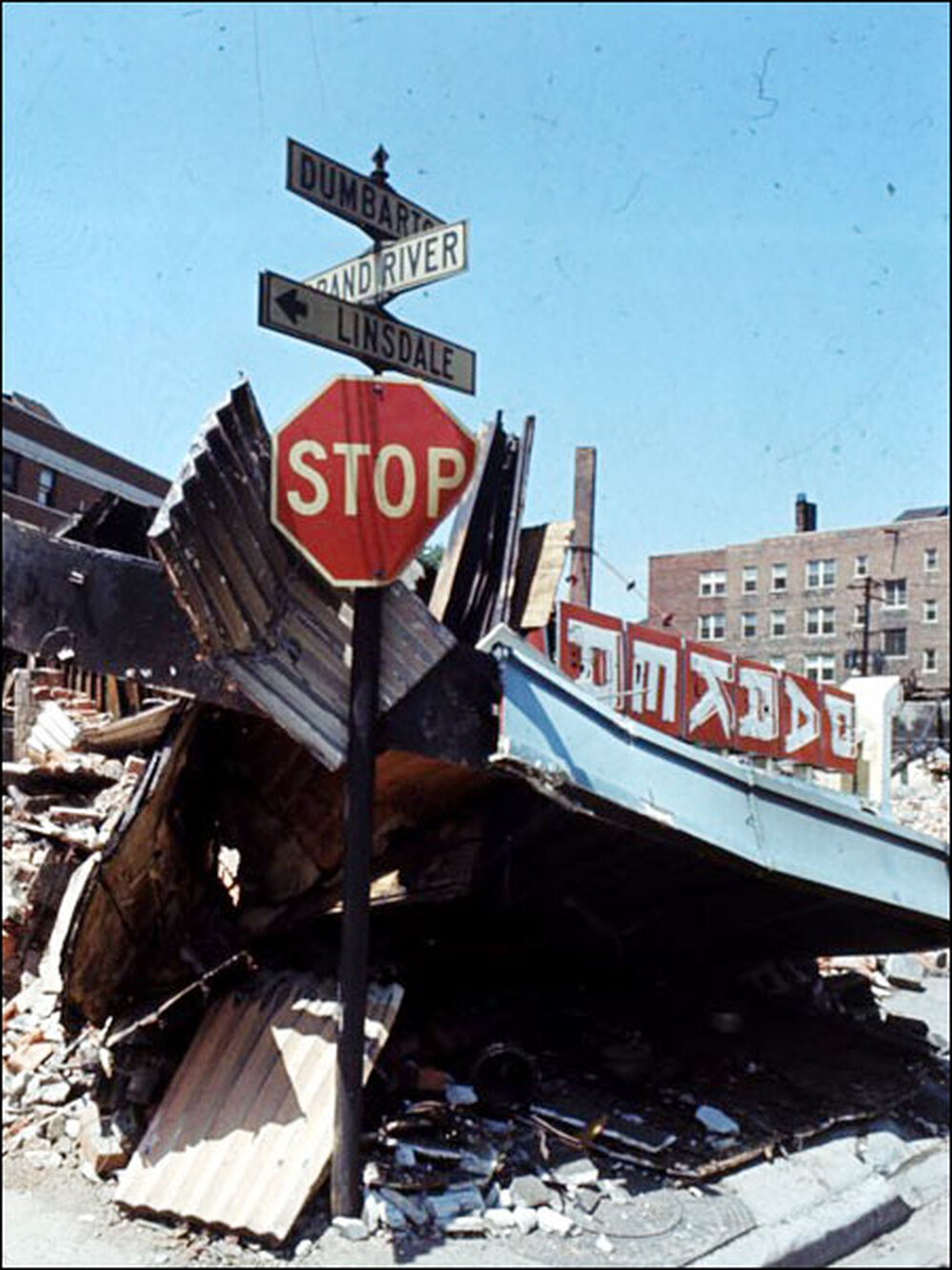 Stop sign amid wreckage