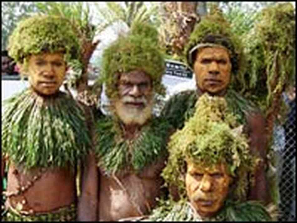 A group of performers stands in Goroka.