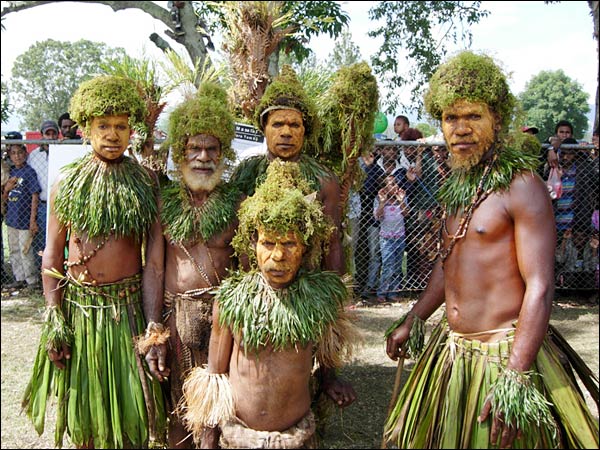 A group of performers stands in Goroka.