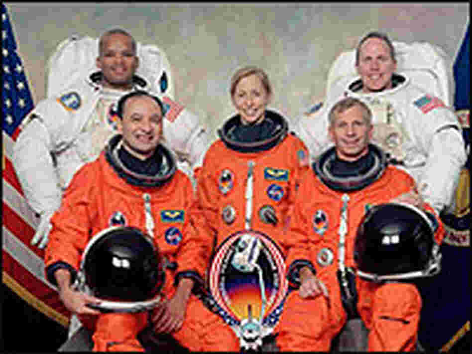Marsha Ivins (center) with her flight crew on the space shuttle, Atlantis, in February, 2001.