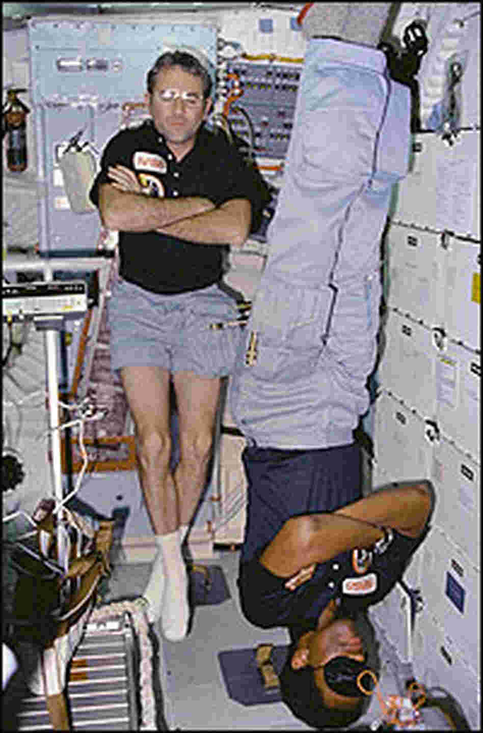 Astronauts Richard "Dick" Truly (left) and Guion Bluford get some sleep during a misson in 1983.
