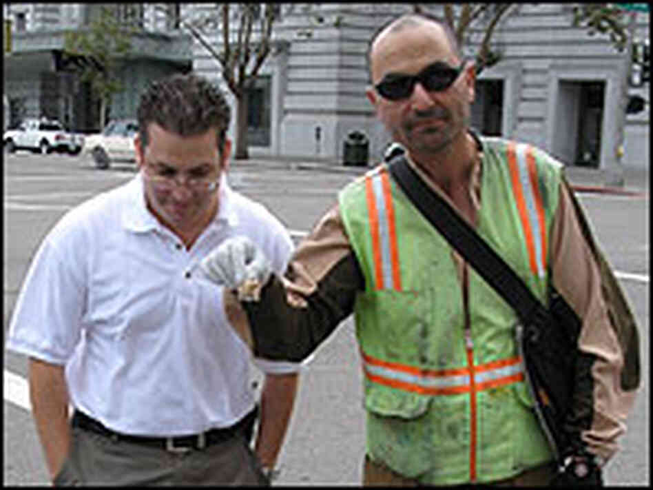Luis Agurto, president of Pestec, stands with Aleen Belkaious, a bicycle messenger. Luis Agurto, president of Pestec, stands with Aleen Belkaious, a bicycle messenger.