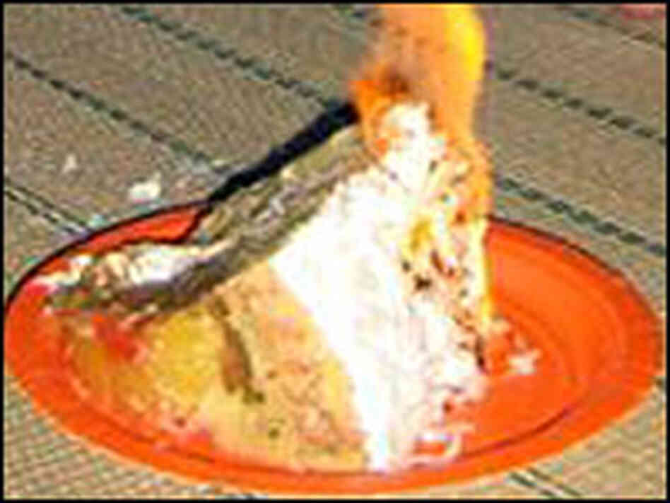A slice of flaming upside-down cake. A slice of flaming upside-down cake.