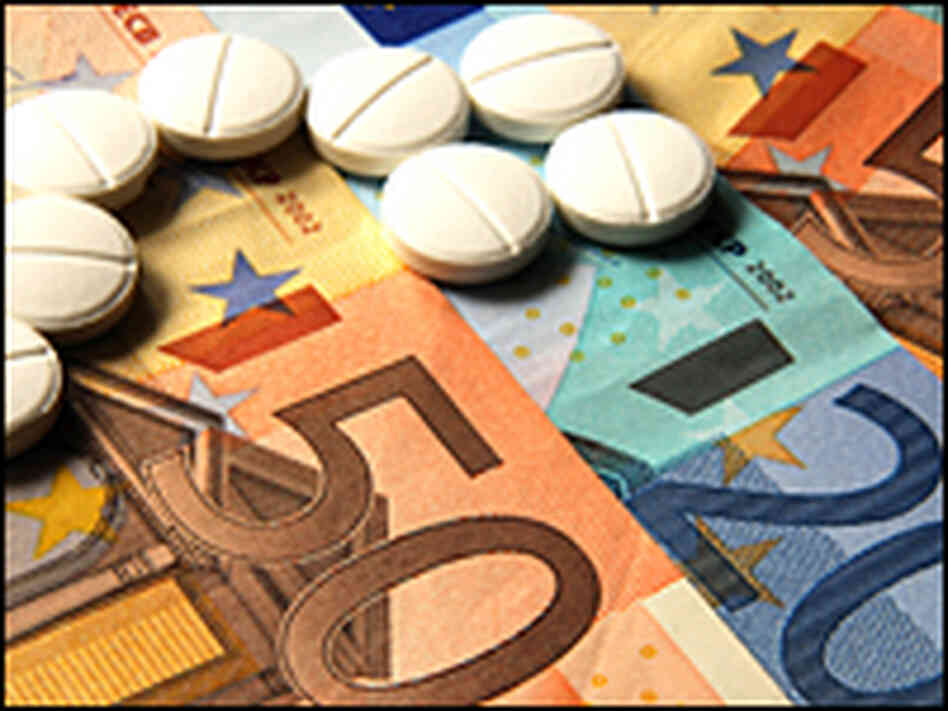 Pills on a pile of euros. Pills on a pile of euros.
