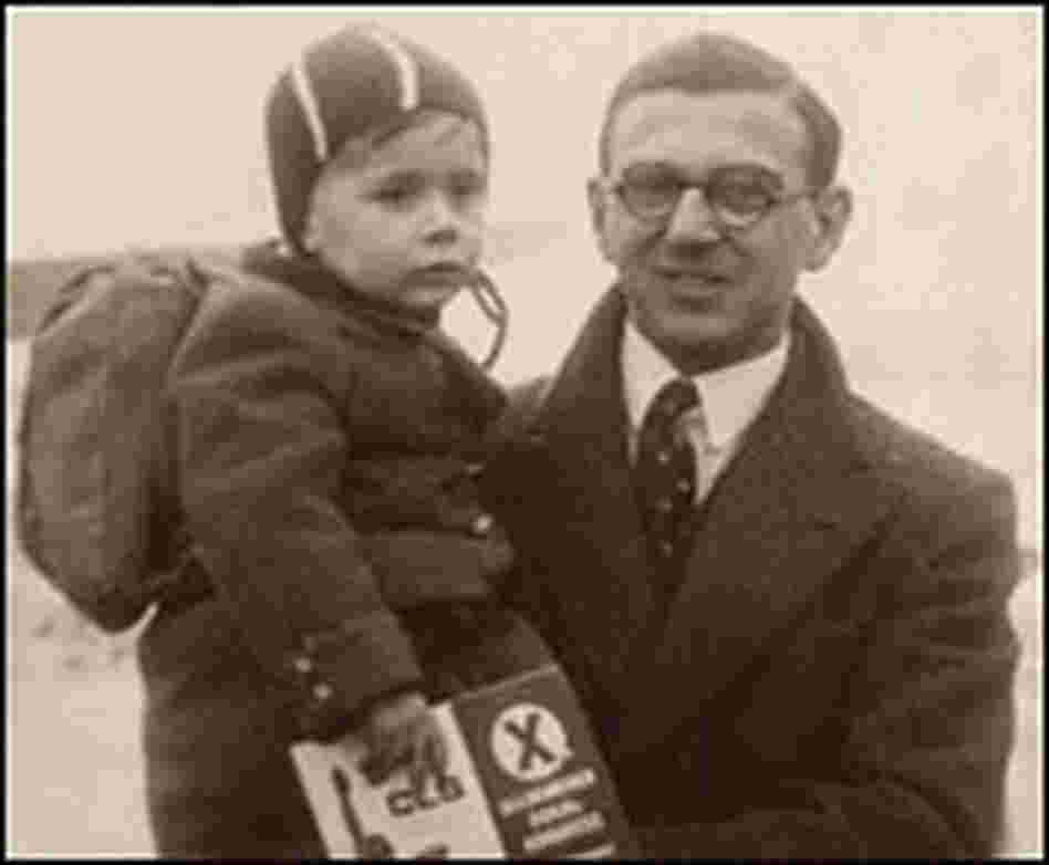 Nicholas Winton holds a child in the Prague train station in 1939.