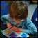 Drayke Hutchinson plays a game. Credit: Heather Murphy/NPR