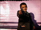 A young boy plays with a plastic gun in Iraq in 2003. A young boy plays with a plastic gun in Iraq in 2003.
