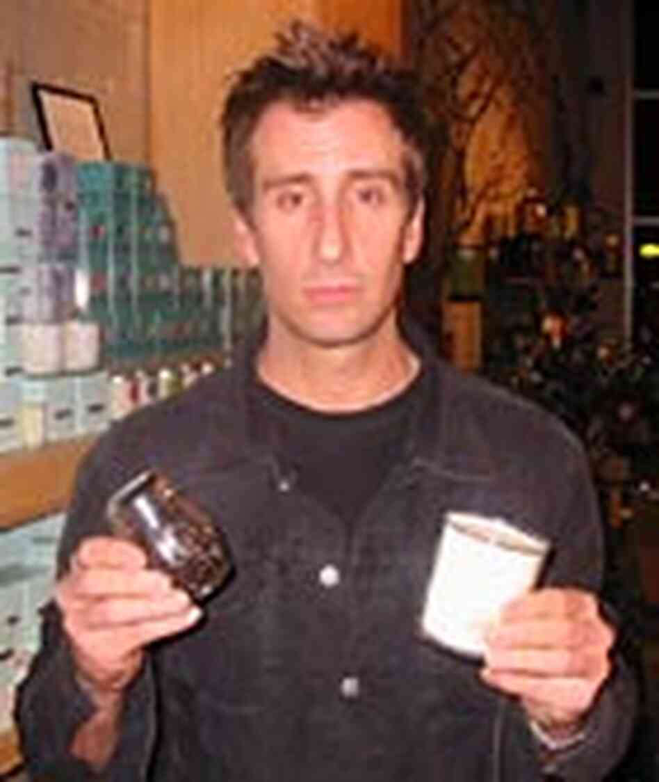 NPR's Brian Unger holds up a candle and coffee shaker at Candle Delirium in Los Angeles. NPR's Brian Unger holds up a candle and coffee shaker at Candle Delirium in Los Angeles.
