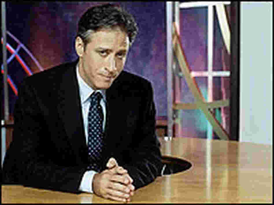 Jon Stewart at his anchor desk. Jon Stewart at his anchor desk.