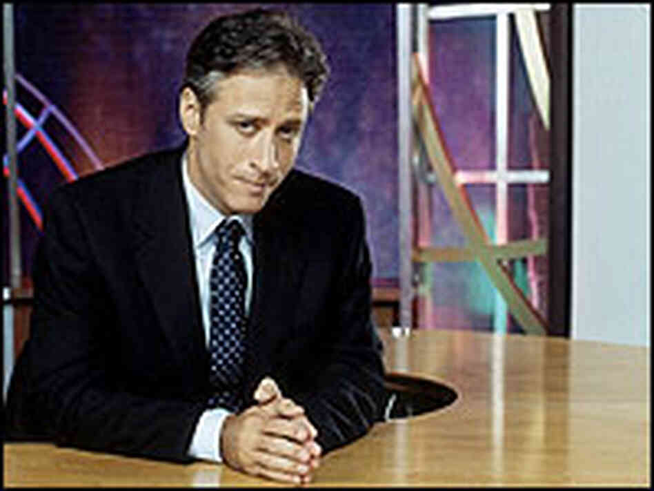 Jon Stewart at his anchor desk. Jon Stewart at his anchor desk.