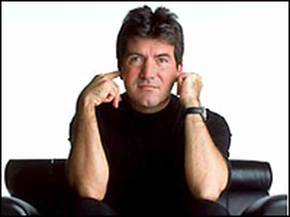 Simon Cowell, striking a pose. Simon Cowell, striking a pose.