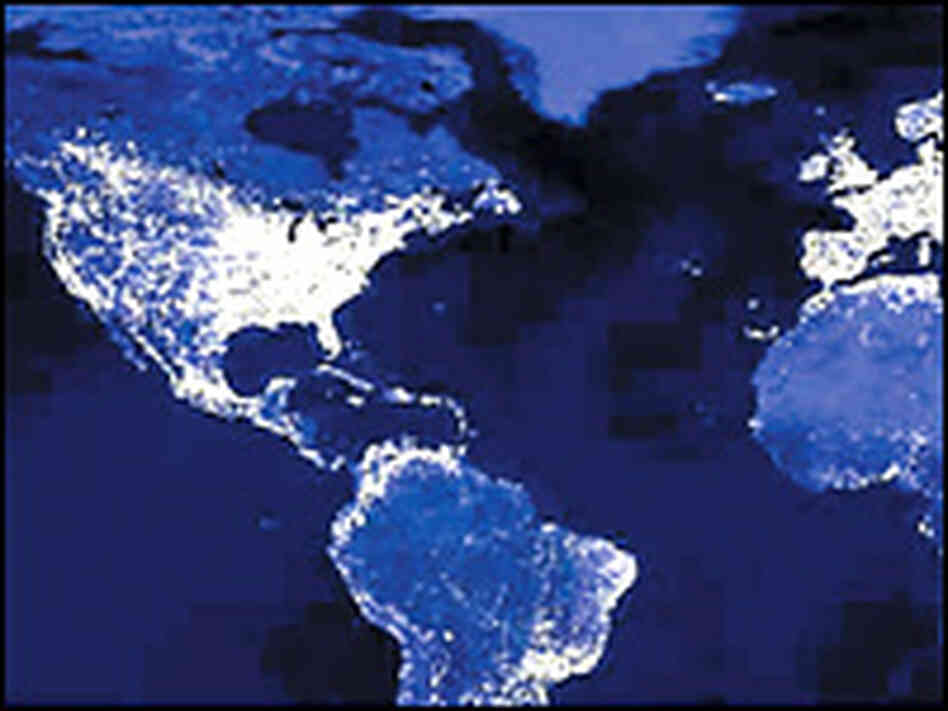 A composite panoramic image of the world at night. 
