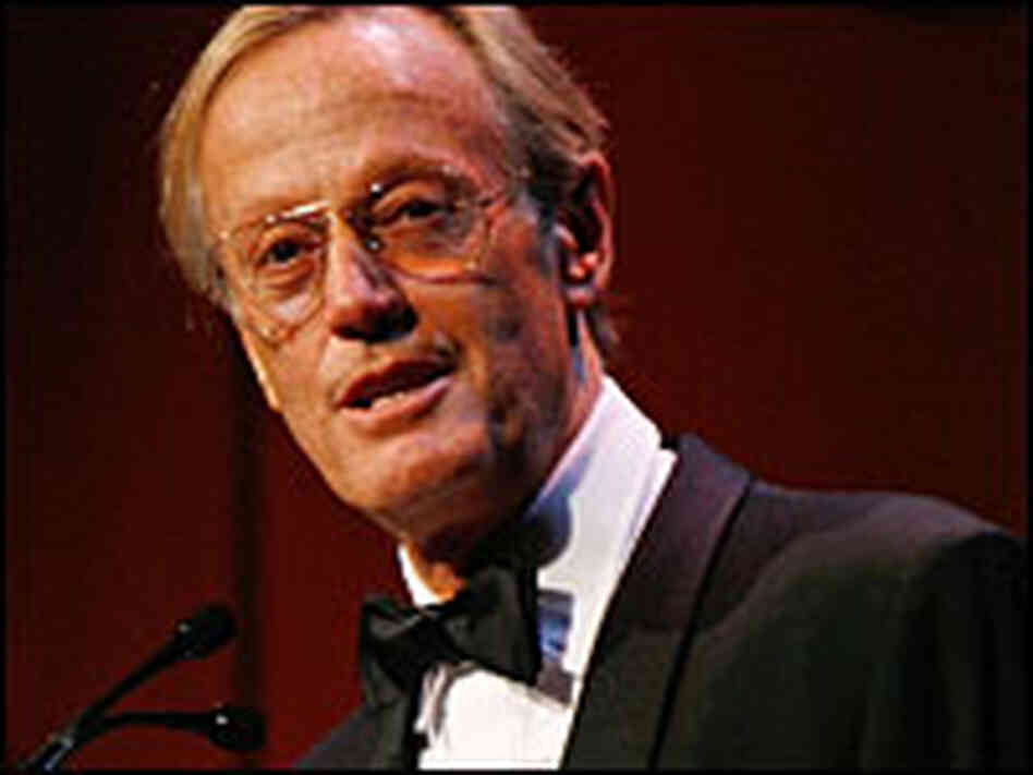 Peter Fonda, in black tie and gold-rimmed glasses, at a microphone Peter Fonda, in black tie and gold-rimmed glasses, at a microphone