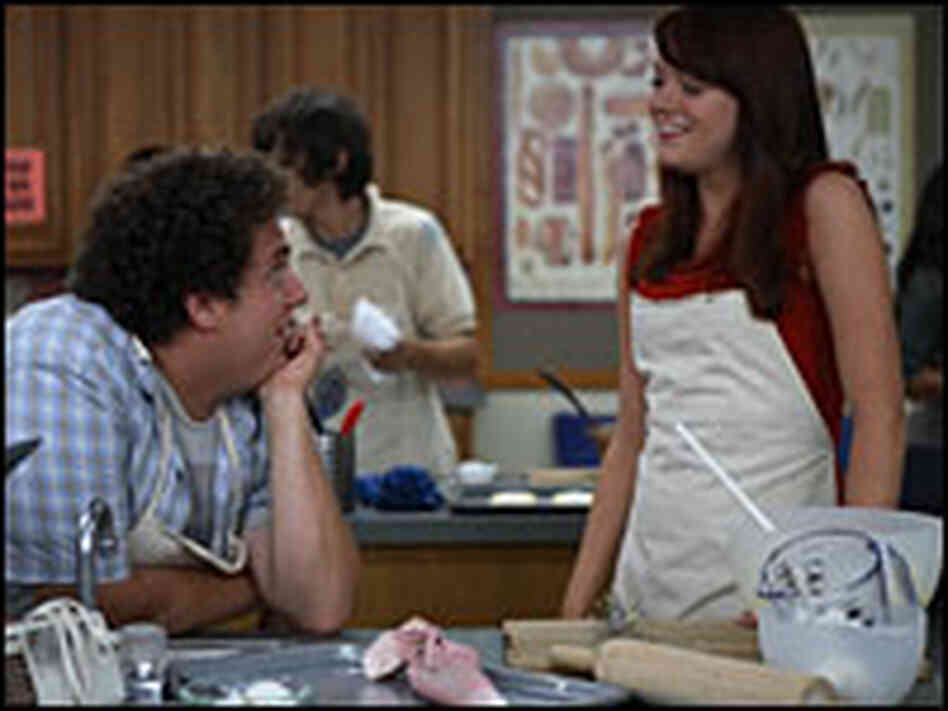 Jonah Hill and Emma Stone at a kitchen island Jonah Hill and Emma Stone at a kitchen island