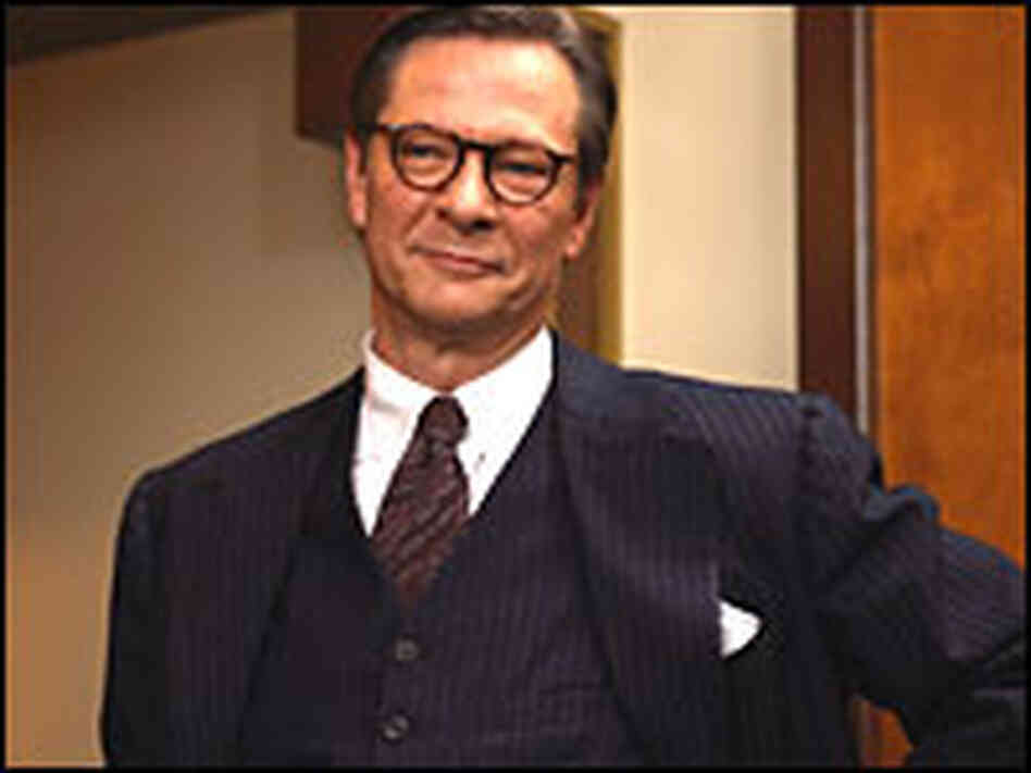 Chris Cooper in horn-rims and a 3-piece suit.