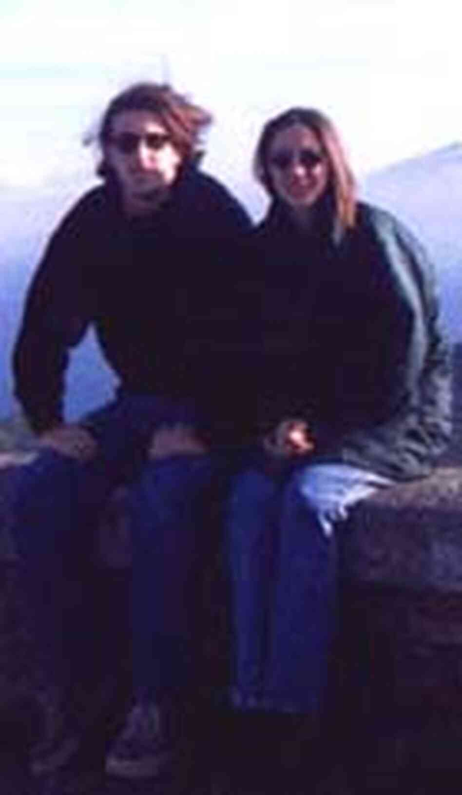 Aviva Barraclough and Kelvin Watkins at a scenic overlook with mountains in the background. Aviva Barraclough and Kelvin Watkins at a scenic overlook with mountains in the background.