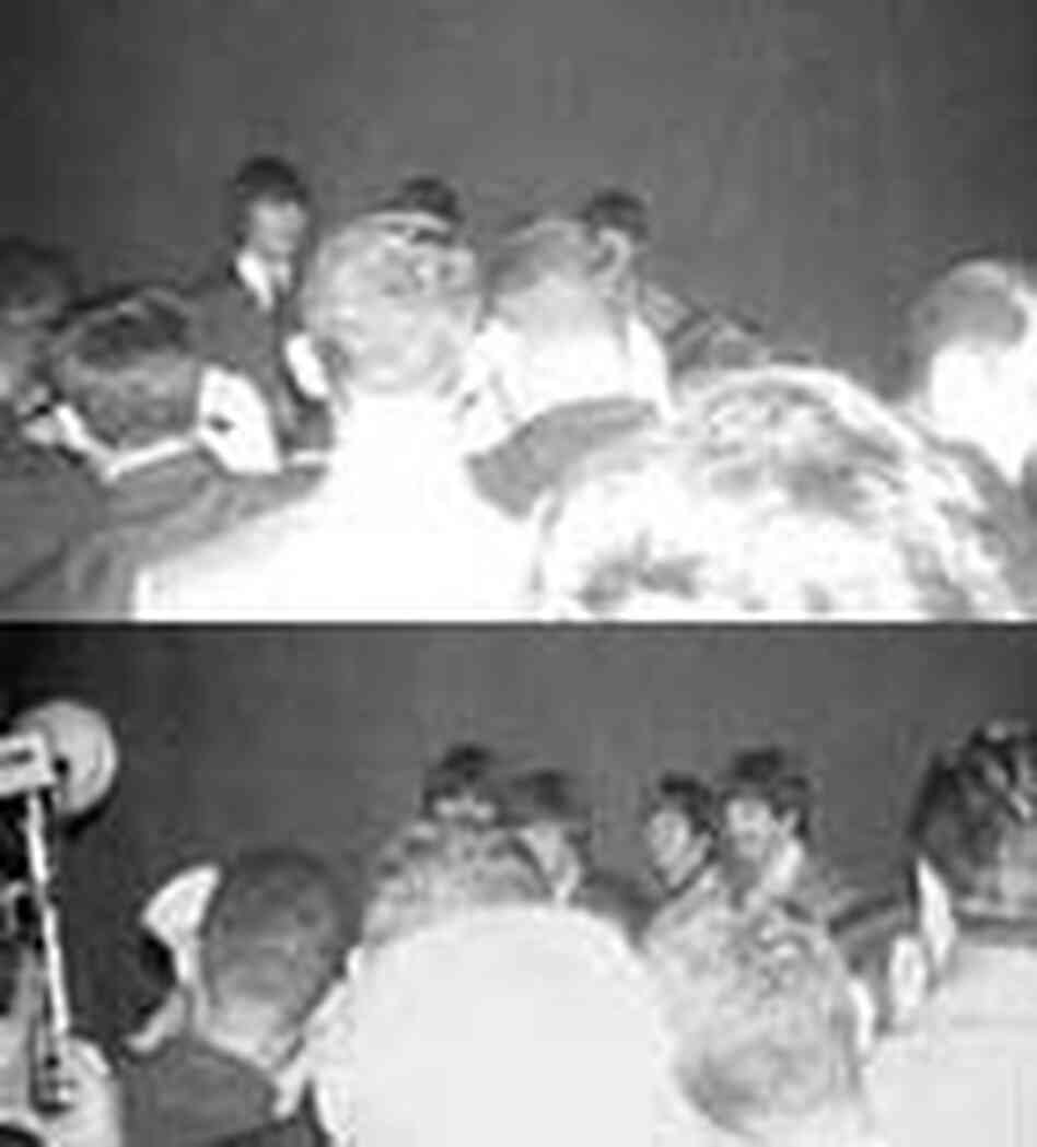 The Beatles meet a crowd of reporters and photographers, August 1964. The Beatles meet a crowd of reporters and photographers, August 1964.