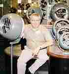 Mike Coup sits among the old equipment and the fans museum in Andover, Kansas Mike Coup sits among the old equipment and the fans museum in Andover, Kansas
