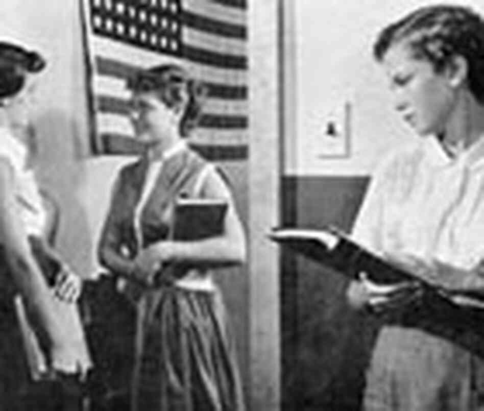 A scene from one of the films. At school, a girl watches as two other school girls talk privately. A scene from one of the films. At school, a girl watches as two other school girls talk privately.