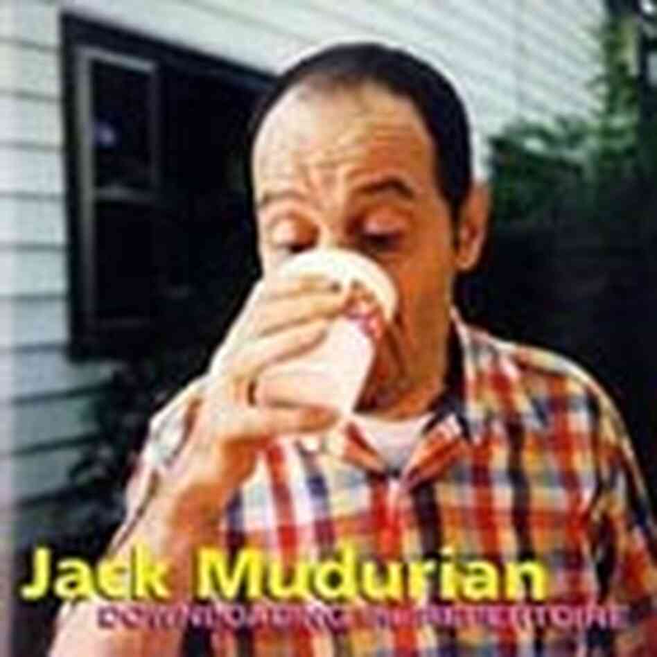 Jack Mudurian drinking a cup of coffee. Jack Mudurian drinking a cup of coffee.