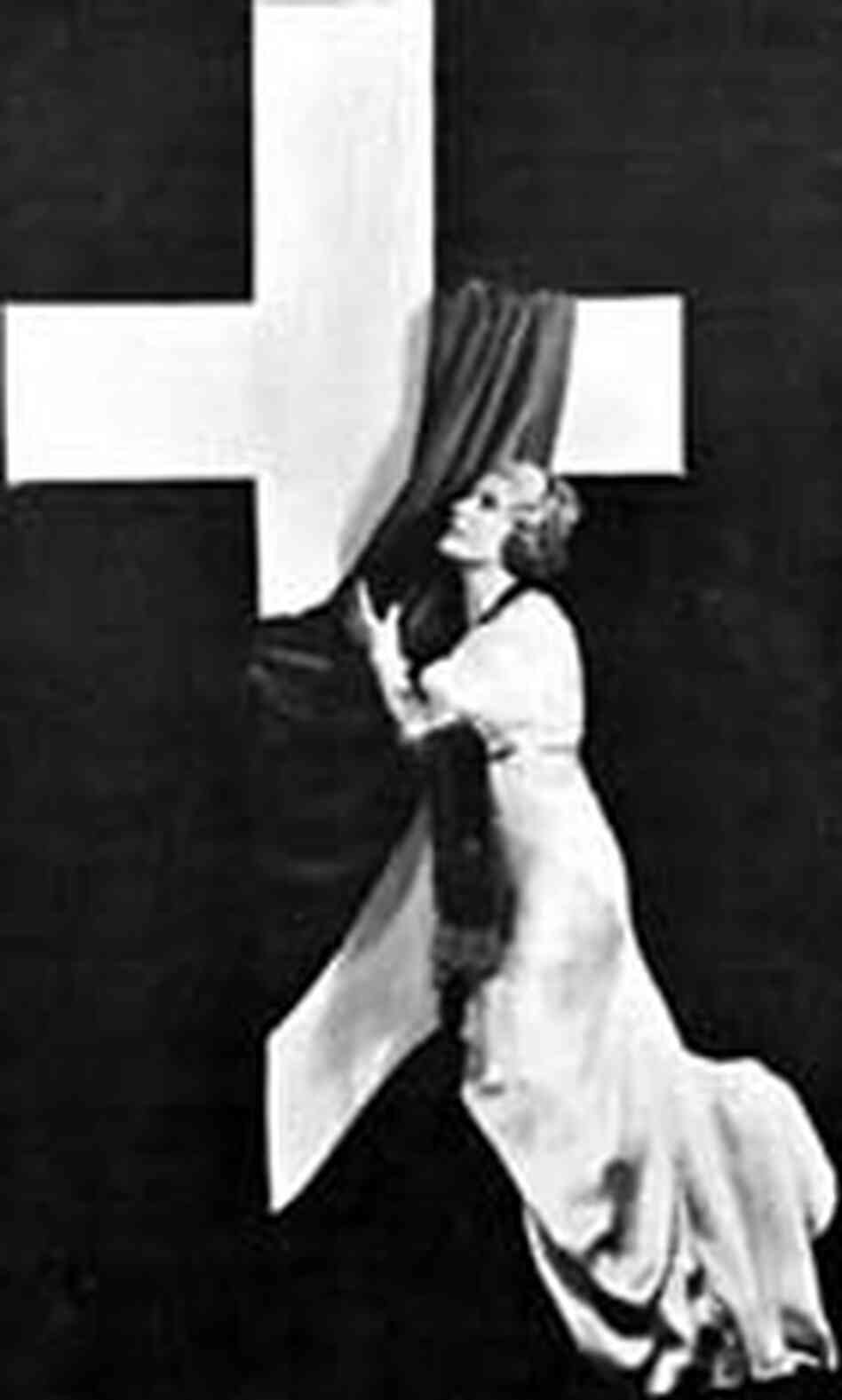 Sister Aimee in front of a cross during a pageant held in Los Angeles in 1935. Sister Aimee in front of a cross during a pageant held in Los Angeles in 1935.