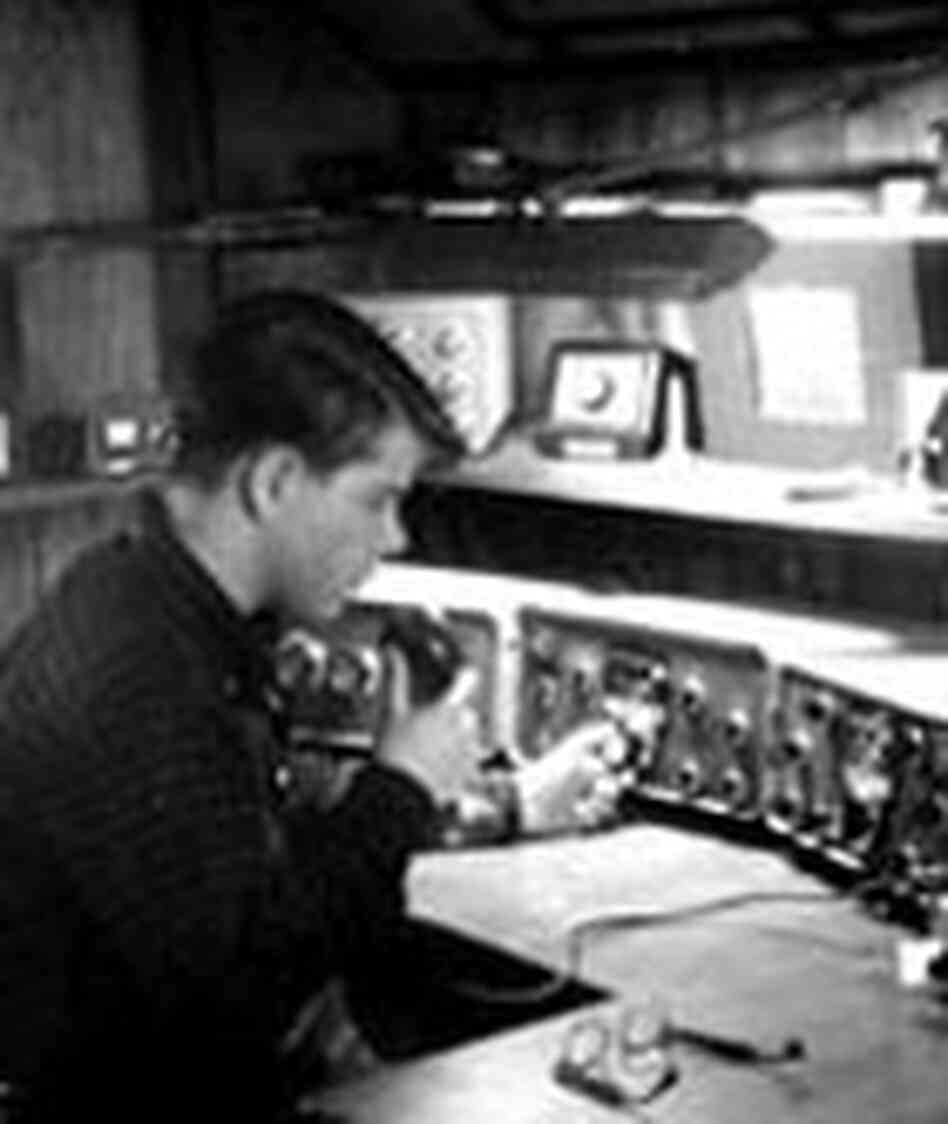 Jonathan Kern at age 15, sitting in a room filled with radio equipment and holding a microphone. Jonathan Kern at age 15, sitting in a room filled with radio equipment and holding a microphone.