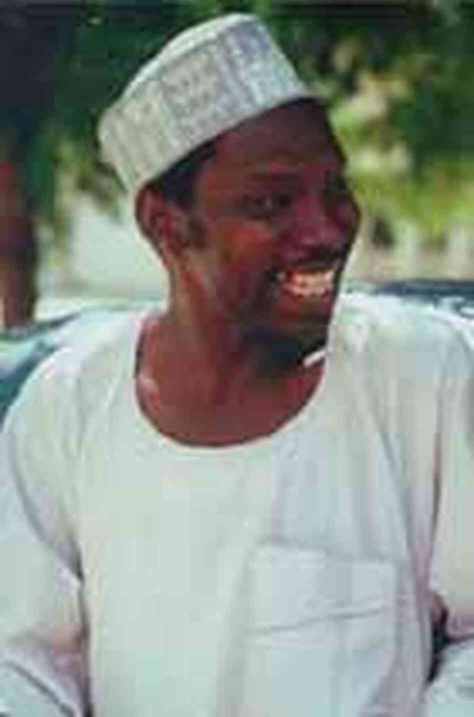 Auwalu in typical Hausa hat and gown. Auwalu in typical Hausa hat and gown.