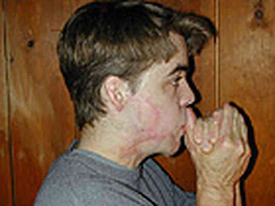 Blowing gently between thumb knuckles Blowing gently between thumb knuckles