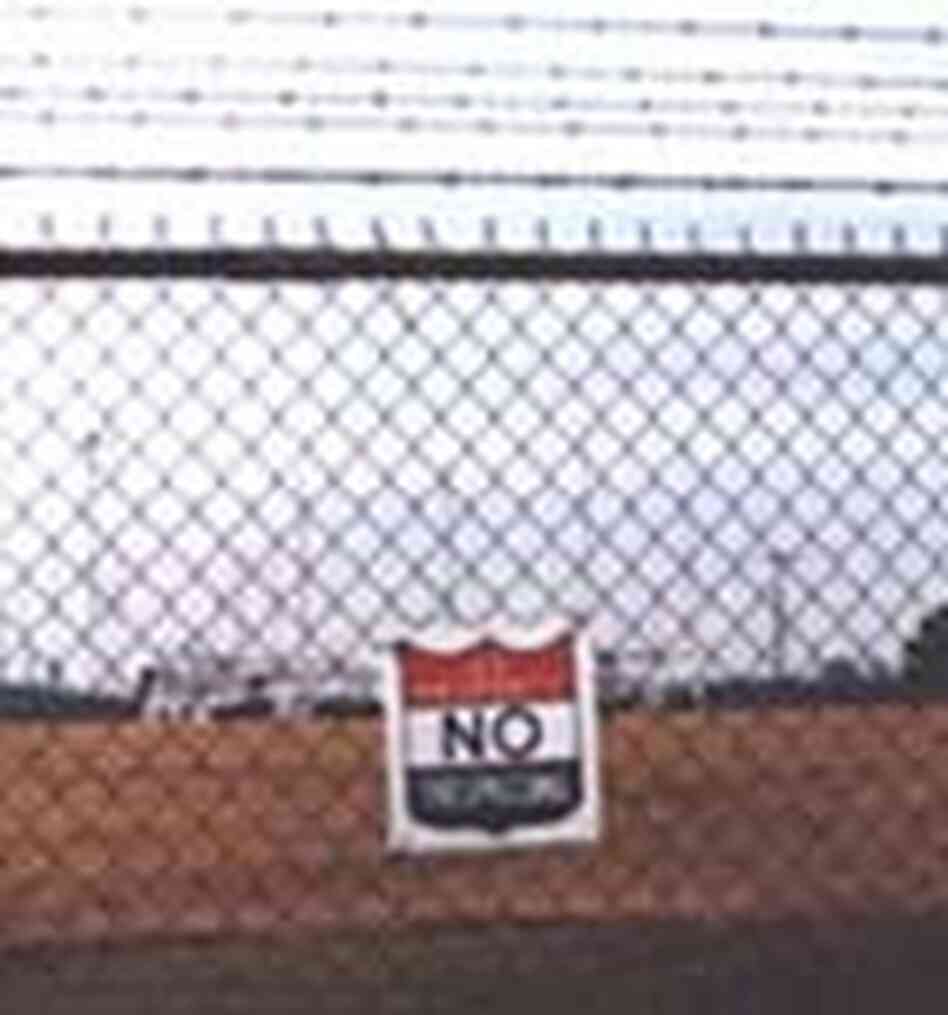Fences topped by barbed wire at the Training Center, National Communication System. Fences topped by barbed wire at the Training Center, National Communication System.
