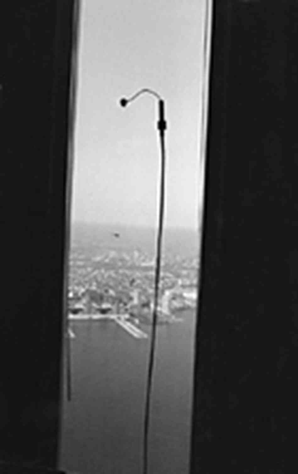 Contact microphone affixed to a window on the 91st floor of World Trade Center Tower One, 1999. Contact microphone affixed to a window on the 91st floor of World Trade Center Tower One, 1999.