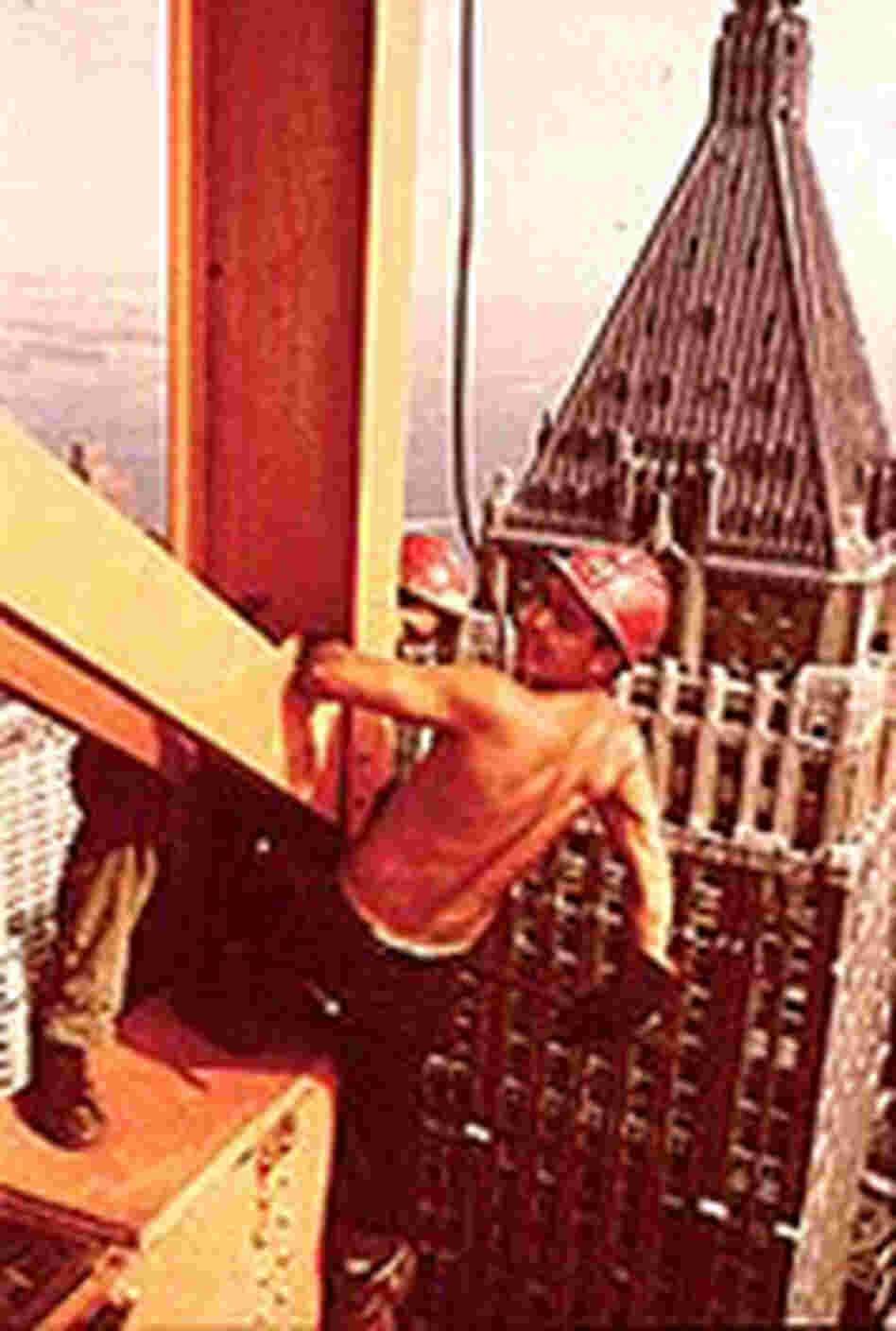 Mohawk Indian ironworker, Joe Regis, holds onto the skeleton of a new skyscraper, circa 1960. Mohawk Indian ironworker, Joe Regis, holds onto the skeleton of a new skyscraper, circa 1960.