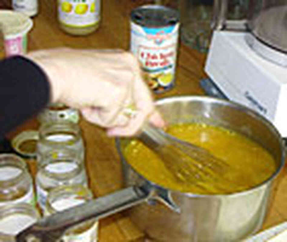 Whisking the ingredients for the soup Whisking the ingredients for the soup