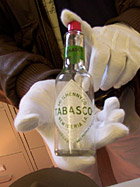 TABASCO historian Shane Bernard displays a 1940s era TABASCO bottle