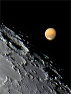 Mars seems to hover above the moon.