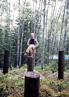 Jeannine Patan� sits on a piling used as the foundation of her house.
