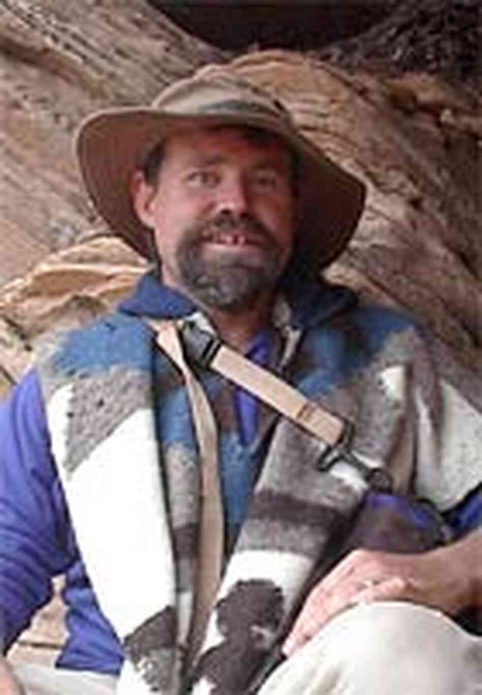 Craig Childs seeks shelter from a sudden rain in a sandstone alcove.