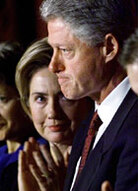 Former U.S. first lady Hillary Rodham Clinton looks at her husband, President Bill Clinton,