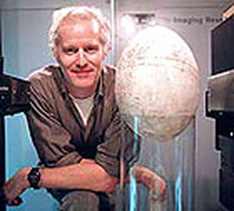 Dr. Tim Rowe poses with elephant bird egg. Dr. Tim Rowe poses with elephant bird egg.