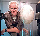 Dr. Tim Rowe poses with elephant bird egg.