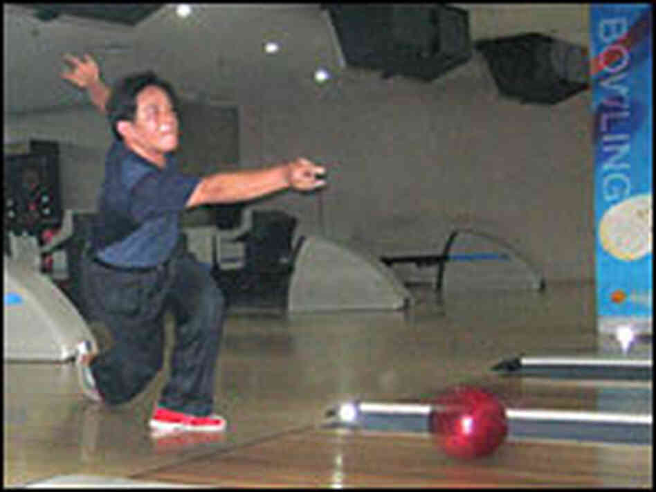 A bowler in Urumqi, in northwestern China A bowler in Urumqi, in northwestern China