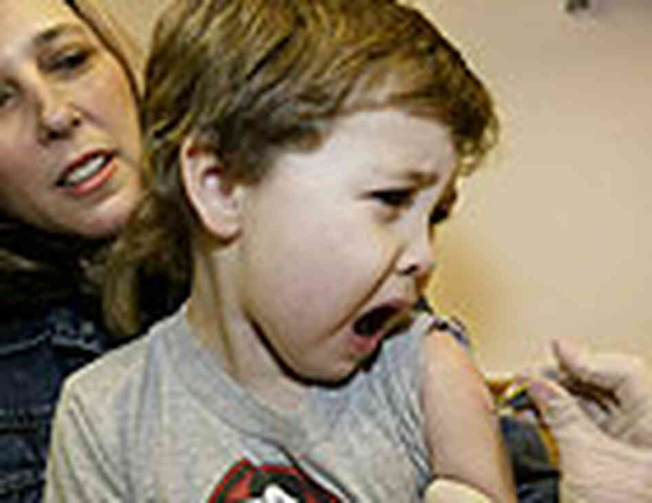 A child is given a vaccine. A child is given a vaccine.