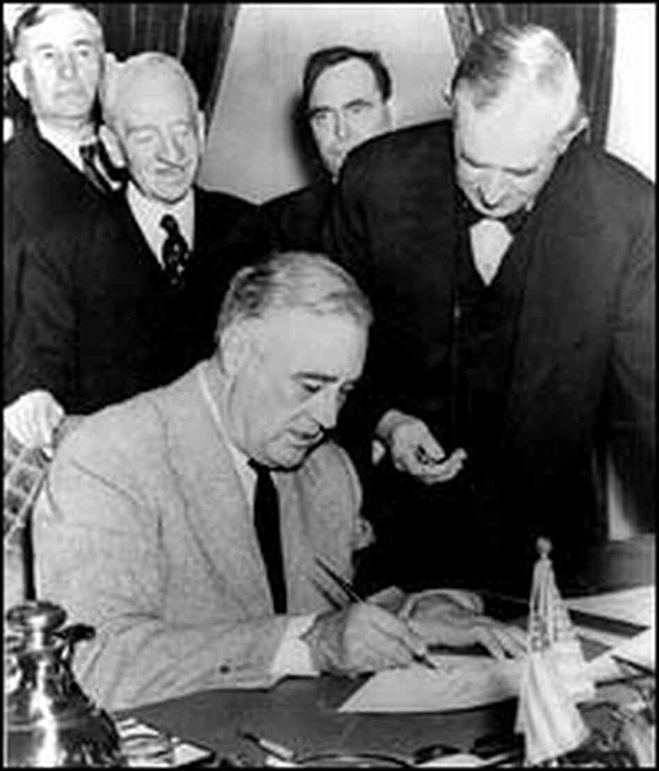 President Roosevelt signs the declaration of war against Japan. President Roosevelt signs the declaration of war against Japan.