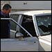 A Tikrit police officer examines the car involved in the incident; Photo: Emily Harris, NPR News