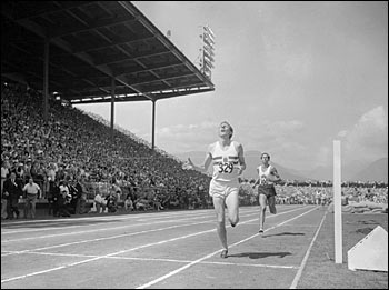 Roger Bannister breaks the tape in the one-mile final at the Empire Games in Vancouver, Aug. 7, 1954, trailed by John Landy, holder of the record for the mile; Credit: � Bettmann/Corbis