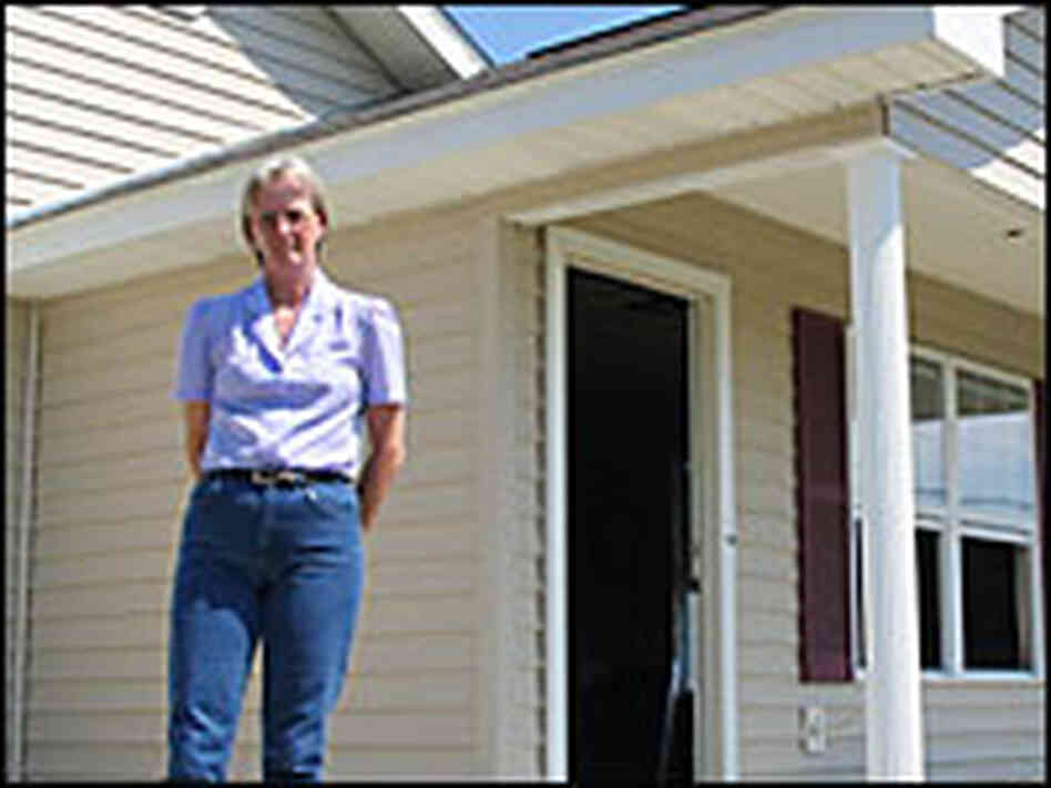 Nanette Sonnier stands in front of her home in Iberia Parish, La. Nanette Sonnier stands in front of her home in Iberia Parish, La.