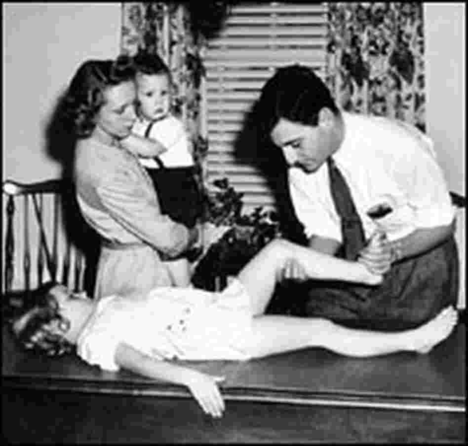 A young child is examined for polio in the 1950s. A young child is examined for polio in the 1950s.