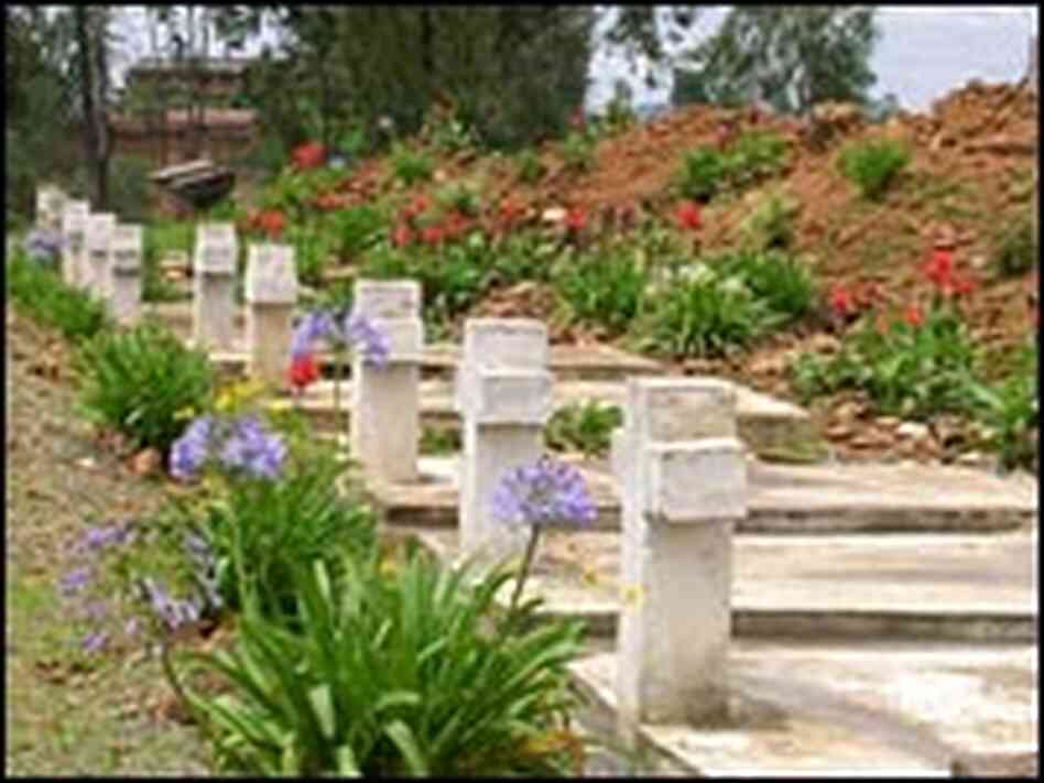 Graves of some of the victims are next to ruins of the church. Graves of some of the victims are next to ruins of the church.