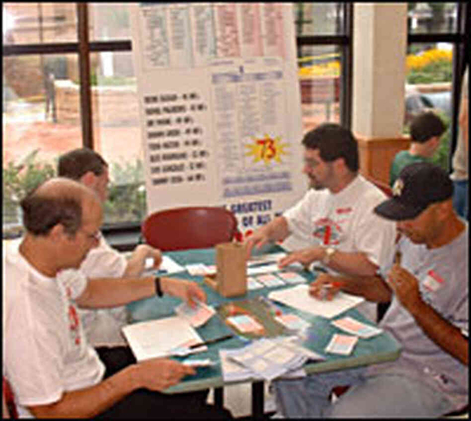 Fans play Strat-O-Matic during a 40th anniversary tournament. Fans play Strat-O-Matic during a 40th anniversary tournament.