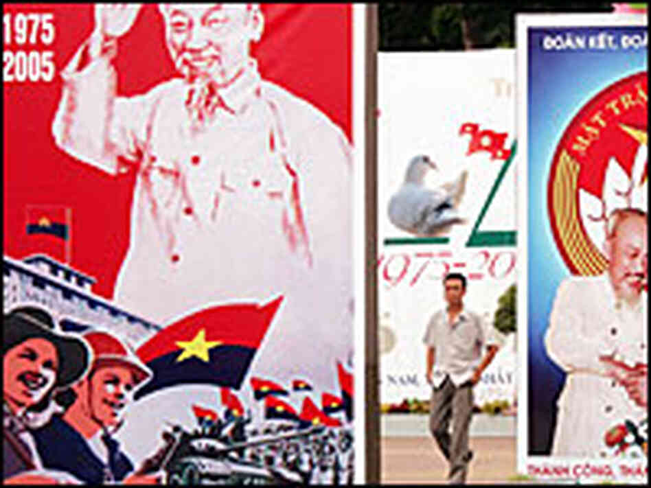 A man walks among posters in Ho Chi Minh City, Vietnam. A man walks among posters in Ho Chi Minh City, Vietnam.
